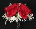This prom bouquet features beautiful red flowers with unique red ribbon to finish it off.