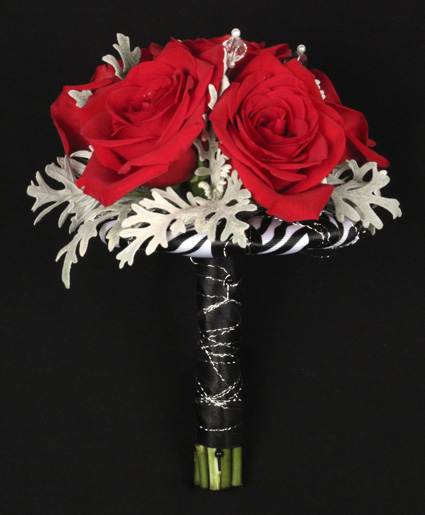 This prom bouquet features beautiful red flowers with unique red ribbon to finish it off.