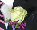 This prom boutonniere is so fun with the light green tinted rose, accents of purple flowers and the blue wire and ribbon.
