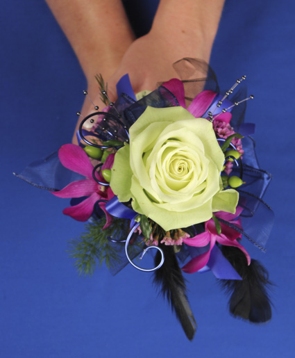 This fun prom bouquet features a single green rose with accents of fuschia flowers, purple ribbon, wire and feathers.