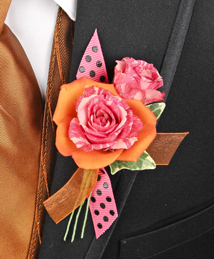 This orange and pink prom corsage features an orange flower with a pink flower inside of it to make a great contrast of colors. Plus, the added accent of the polka dot & orange ribbon makes it stand out.