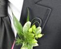 This prom boutonniere features the color green throughout every aspect.